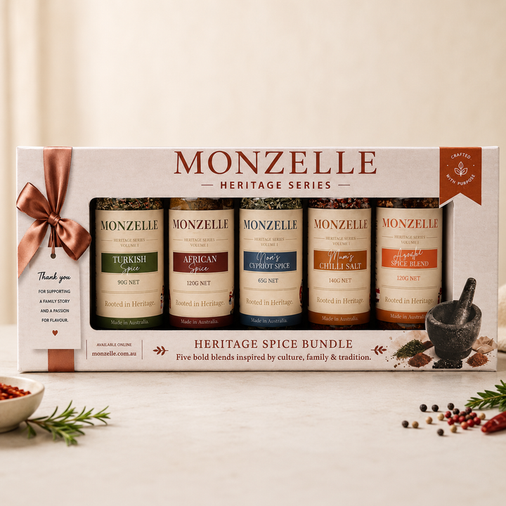 Monzelle Heritage Spice Bundle packaging with five spice jars and a mortar and pestle on a light background.